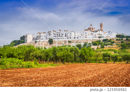 Locorotondo, Italy is a charming Apulian hilltop town known for whitewashed houses and circular layout Locorotondo, Italy is a charming Apulian hilltop town known for whitewashed houses and circular layout 125958982