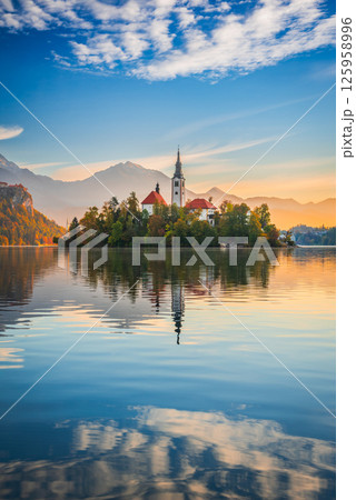 Bled, Slovenia. Beautiful sunrise sky colors over Lake Bled Bled, Slovenia. Beautiful sunrise sky colors over Lake Bled 125958996