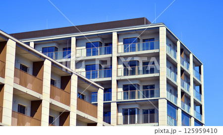 Modern new residential apartment house building complex. Exterior view of modern apartment building. New construction apartment or condo complex. Modern new residential apartment house building complex. Exterior view of modern apartment building. New construction apartment or condo complex. 125959410
