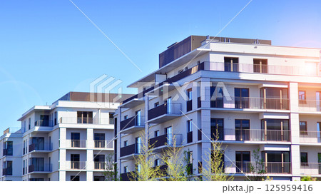 Modern new residential apartment house building complex. Exterior view of modern apartment building. New construction apartment or condo complex. 125959416