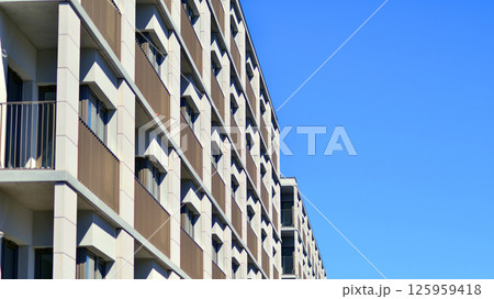 Modern new residential apartment house building complex. Exterior view of modern apartment building. New construction apartment or condo complex. 125959418