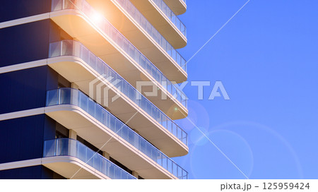 Modern new residential apartment house building complex. Exterior view of modern apartment building. New construction apartment or condo complex. 125959424