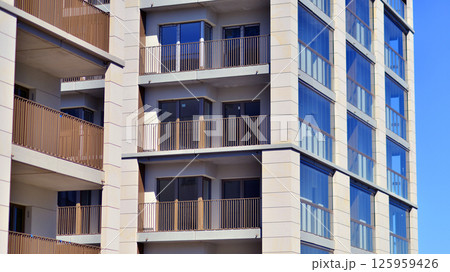 Modern new residential apartment house building complex. Exterior view of modern apartment building. New construction apartment or condo complex. 125959426