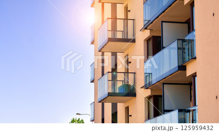 Modern new residential apartment house building complex. Exterior view of modern apartment building. New construction apartment or condo complex. Modern new residential apartment house building complex. Exterior view of modern apartment building. New construction apartment or condo complex. 125959432