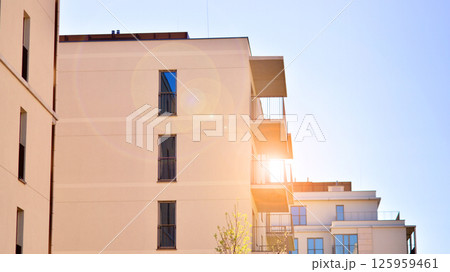 Modern new residential apartment house building complex. Exterior view of modern apartment building. New construction apartment or condo complex. 125959461