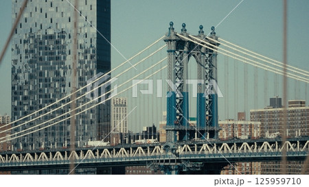 Manhattan Bridge connecting two sides of New York City with modern skyscraper in background Manhattan Bridge connecting two sides of New York City with modern skyscraper in background 125959710