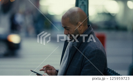 Businessman using smartphone in Manhattan, New York Businessman using smartphone in Manhattan, New York 125959723