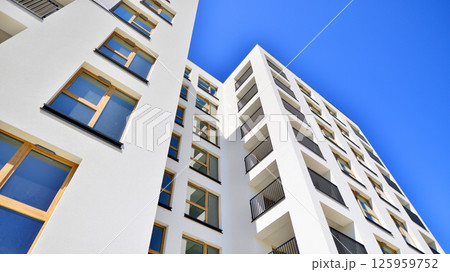 Modern new residential apartment house building complex. Exterior view of modern apartment building. New construction apartment or condo complex. Modern new residential apartment house building complex. Exterior view of modern apartment building. New construction apartment or condo complex. 125959752