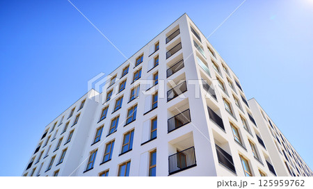Modern new residential apartment house building complex. Exterior view of modern apartment building. New construction apartment or condo complex. 125959762