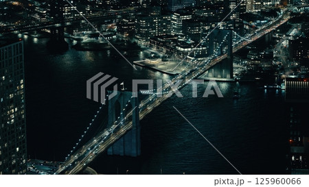 Brooklyn Bridge connecting Manhattan and Brooklyn at night, New York City Brooklyn Bridge connecting Manhattan and Brooklyn at night, New York City 125960066