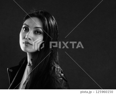 Thoughtful Woman in Dramatic Black and White Portrait 125960150