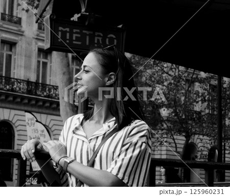 Young woman waiting at a metro station in Paris 125960231