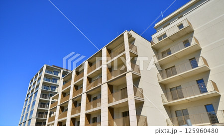 Modern new residential apartment house building complex. Exterior view of modern apartment building. New construction apartment or condo complex. 125960480