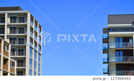 Modern new residential apartment house building complex. Exterior view of modern apartment building. New construction apartment or condo complex. 125960493
