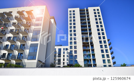 Modern new residential apartment house building complex. Exterior view of modern apartment building. New construction apartment or condo complex. Modern new residential apartment house building complex. Exterior view of modern apartment building. New construction apartment or condo complex. 125960674