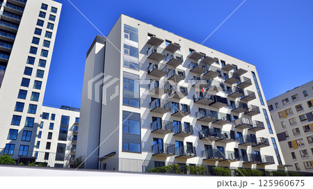 Modern new residential apartment house building complex. Exterior view of modern apartment building. New construction apartment or condo complex. 125960675