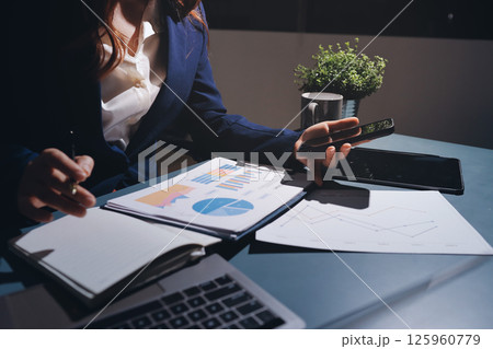 Expert woman asian female people review data number costing managerial account prepare monthly actual cost variance report at tax audit office. ESG sheet budget control ERP process service project. 125960779