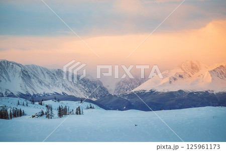 snow-capped mountains at dawn in wintertime 125961173