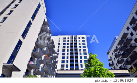 Eco apartment building saving energy and fresh air. Modern block of flats in green area, residential apartment and luxury house complex. Eco apartment building saving energy and fresh air. Modern block of flats in green area, residential apartment and luxury house complex. 125961924
