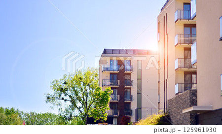 Eco apartment building saving energy and fresh air. Modern block of flats in green area, residential apartment and luxury house complex.  125961930