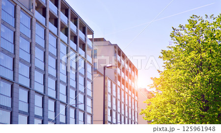Eco apartment building saving energy and fresh air. Modern block of flats in green area, residential apartment and luxury house complex.  125961948