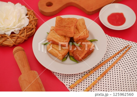 a plate of Indonesian fried tofu a plate of Indonesian fried tofu 125962560