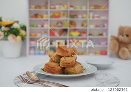 a plate of Indonesian fried tofu a plate of Indonesian fried tofu 125962561