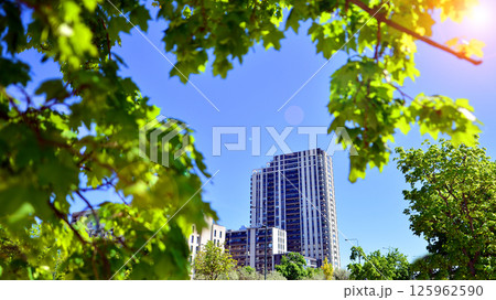 Eco apartment building saving energy and fresh air. Modern block of flats in green area, residential apartment and luxury house complex. Eco apartment building saving energy and fresh air. Modern block of flats in green area, residential apartment and luxury house complex. 125962590