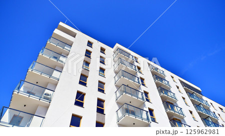 Modern new residential apartment house building complex. Exterior view of modern apartment building. New construction apartment or condo complex. Modern new residential apartment house building complex. Exterior view of modern apartment building. New construction apartment or condo complex. 125962981