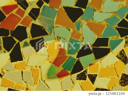 Abstract wall of ceramic shards. Ceramic mosaic or tiles on vintage wall or floor in retro style and warm colours. Decorative elements pattern texture 125963104