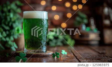 Green beer in pint glass for St. Patrick Day celebration, surrounded by clovers and cozy pub atmosphere Green beer in pint glass for St. Patrick Day celebration, surrounded by clovers and cozy pub atmosphere 125965975