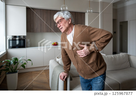 Hard breathing exhausted old man suffer acute chest pain, coronary artery blockage, myocardial issue 125967877