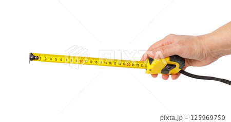 Hand holding measuring tape on white background Hand holding measuring tape on white background 125969750