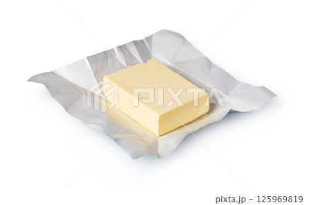 Wrapped butter block on white background: dairy product photography 125969819