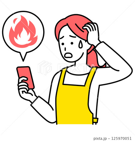 SNSが炎上して困惑しているエプロン姿の女性（スマートフォン） 125970051