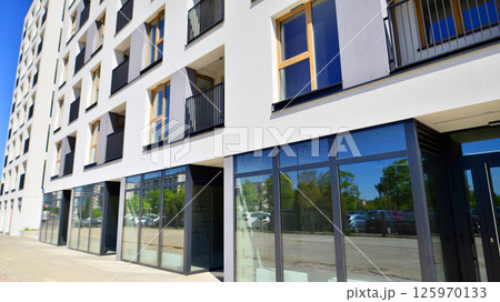 Panoramic windows of new commercial premises. Commercial property in development standard for rent. 125970133