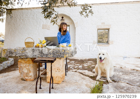 Remote work outside trullo house 125970239