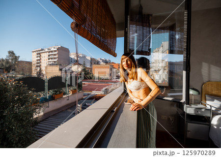 Sunlit Pause on a Roman Balcony 125970289