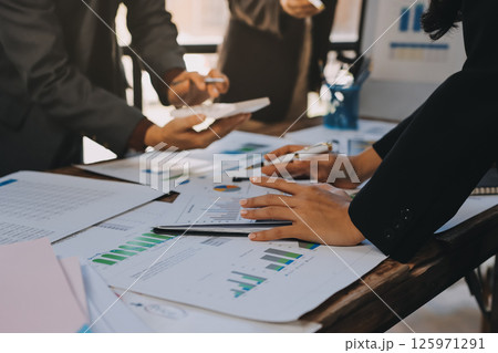 Accounting company provide finance and taxation planning for profitable cash flow, Auditor and accountant team working in office, analyze financial data and accounting record with calculator.Insight Accounting company provide finance and taxation planning for profitable cash flow, Auditor and accountant team working in office, analyze financial data and accounting record with calculator.Insight 125971291