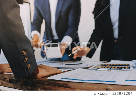 Accounting company provide finance and taxation planning for profitable cash flow, Auditor and accountant team working in office, analyze financial data and accounting record with calculator.Insight Accounting company provide finance and taxation planning for profitable cash flow, Auditor and accountant team working in office, analyze financial data and accounting record with calculator.Insight 125971294