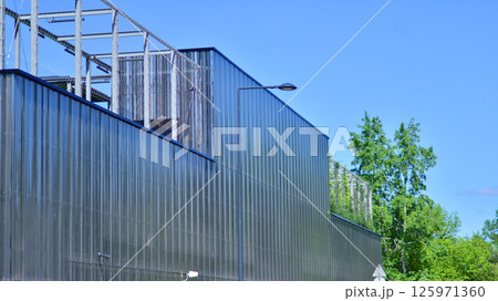 Architecture details of modern metal sheet facade storage building minimal style. 125971360