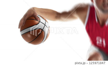 Basketball player in motion and action. Male basketball athlete dribbling the ball. Basketball close-up. Focus on the ball. Isolated 125971847