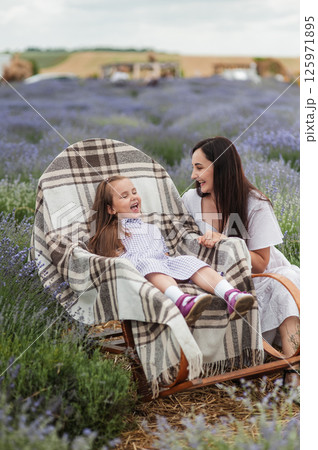 A young mother with her daughter. Aromatherapy. A young mother with her daughter. Aromatherapy. 125971895