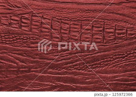 Crocodile genuine leather texture macro, red leatherette with metallic, pearlescent effect 125972366