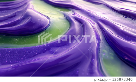 Fluid paint macro showing purple and green swirling patterns, abstract liquid art texture for creative design backgrounds 125973340