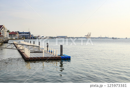 Floating Jigsaw or floating plastic pontoon walkway floating in the sea. Plastic Floating Dock. Plastic Pontoon bridge. 125973381