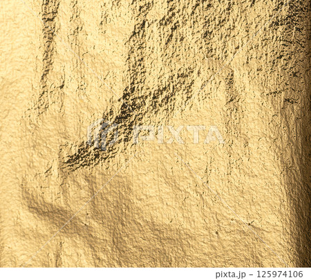 Gold foil background with a vintage, worn texture. Polished, sleek metal pattern, rich in detail and 125974106