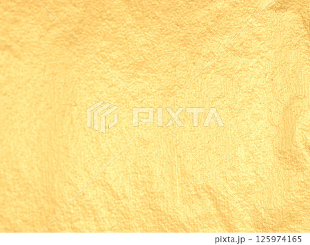 Golden foil leaf with warm, soft light. Subtle, satin texture and reflective surface create a Golden foil leaf with warm, soft light. Subtle, satin texture and reflective surface create a 125974165