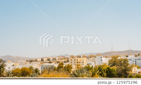 A picture of the city of Muttrah in the Sultanate of Oman, which features two historic castles from ancient times 125975296
