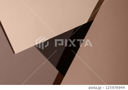 Abstract composition of layered paper textures in soft neutral tones with geometric shapes. 125976944